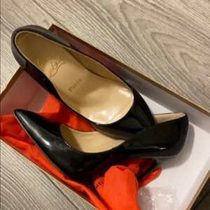 Black high heels red sole